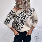 Langry leopard print stud winter sweater with off-shoulder neckline and ribbed cuffs on beige background