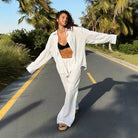 Woman in white linen outfit showcasing Langry fashion from Cotton Shirt Trousers Casual Sets