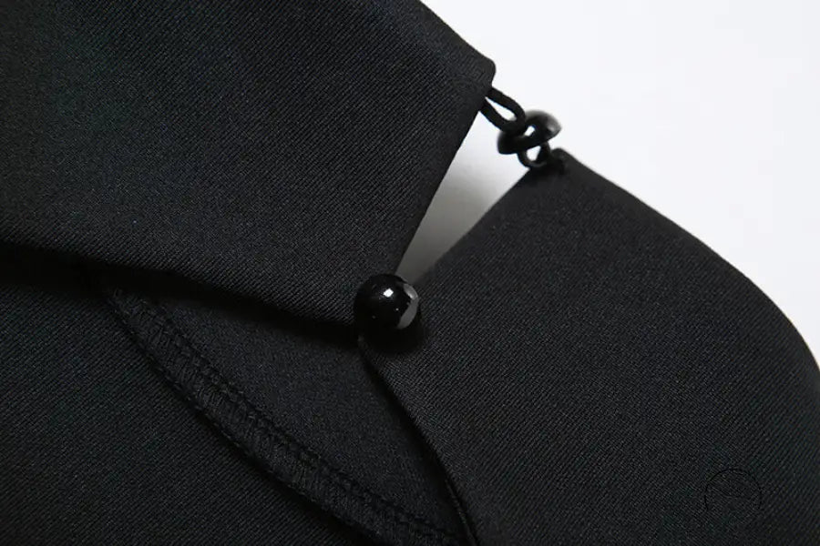 High class elegant A-line dress in black fabric with bead closures