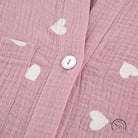 Pink muslin pajamas set with white heart patterns and button