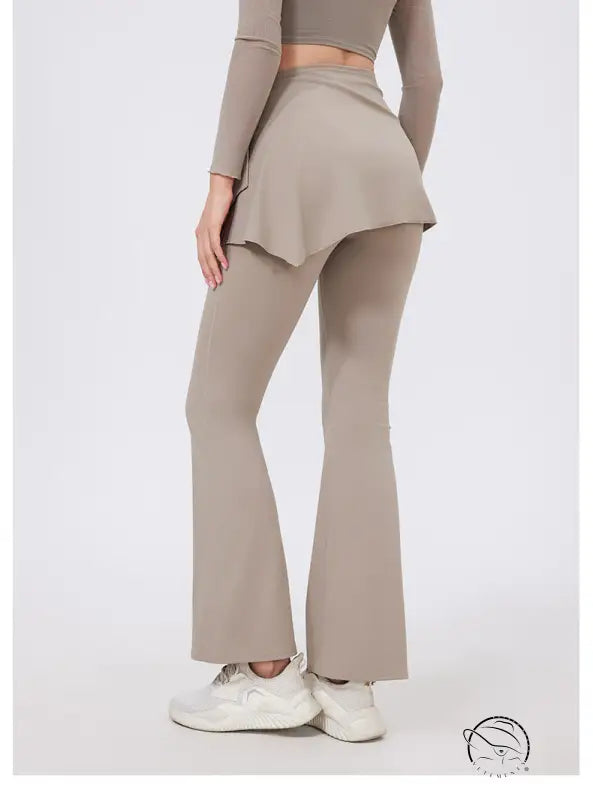 Taupe hip lifting yoga pants with nude feel peplum waistband and white sneakers