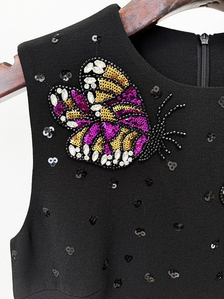 Black dress with beaded butterfly detail, elegant fashion for modern ملابس styles