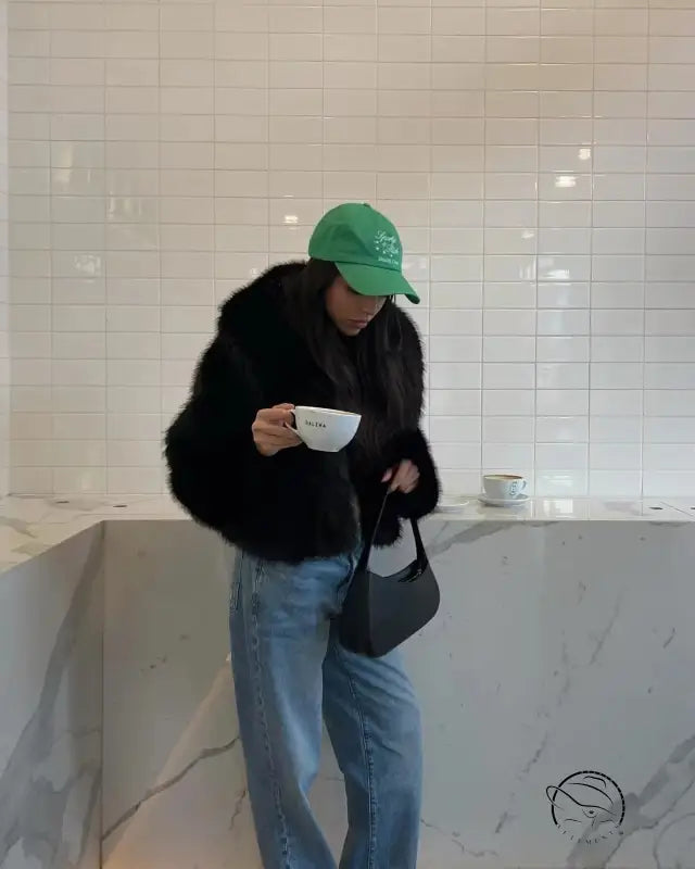 Gorgeous faux fur fox jacket with Langry green cap and leather bag