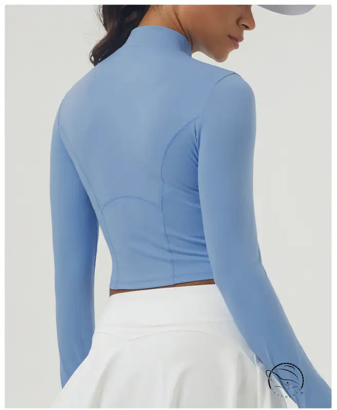 Periwinkle long sleeve sports jacket with mock neck and sculpted seams