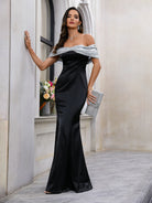 Elegant off-shoulder black gown in a fashion langry style, perfect for special occasions