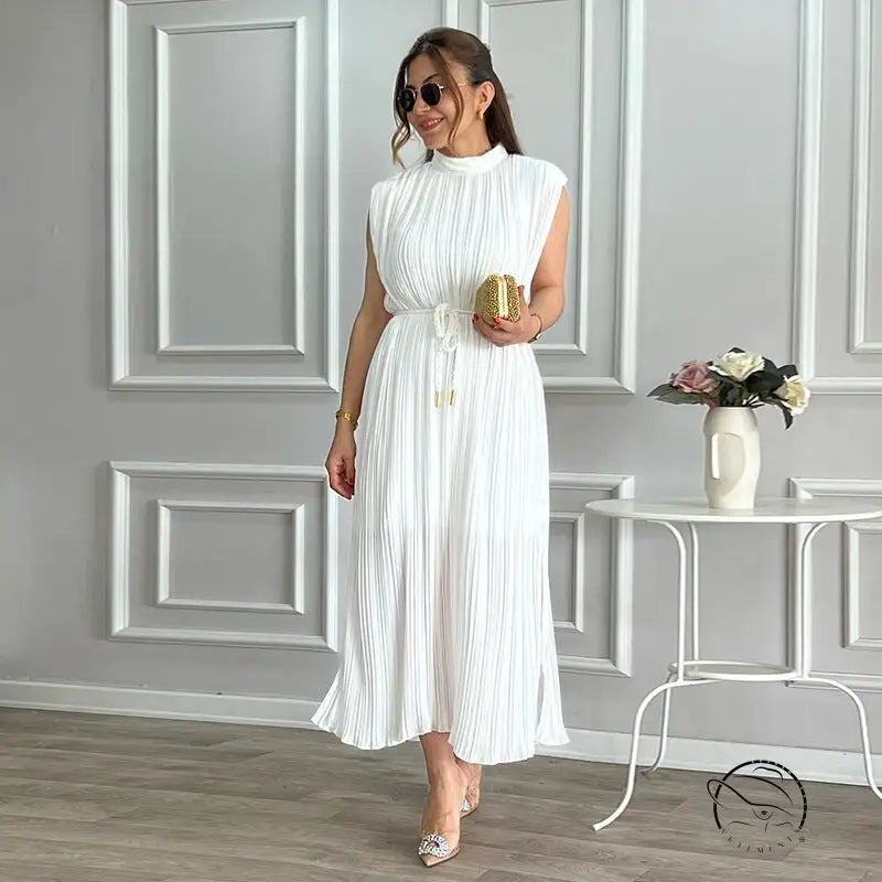 White pleated mid length dress with waist control and lace up details