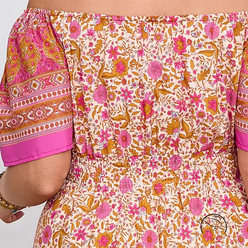 Elegant bohemian dress with floral off-shoulder top and smocked waist
