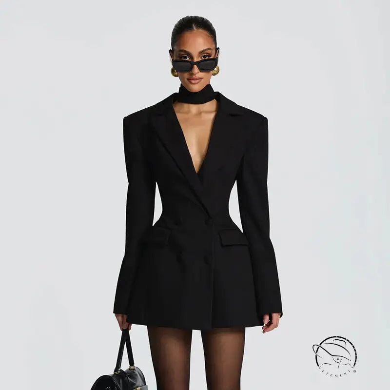 Black long sleeve blazer dress with exaggerated shoulders and deep v-neckline