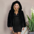 Cozy black faux fur coat with long plush sleeves and voluminous collar