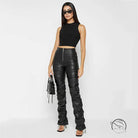 Woman in tight faux leather crop top and ruched pants