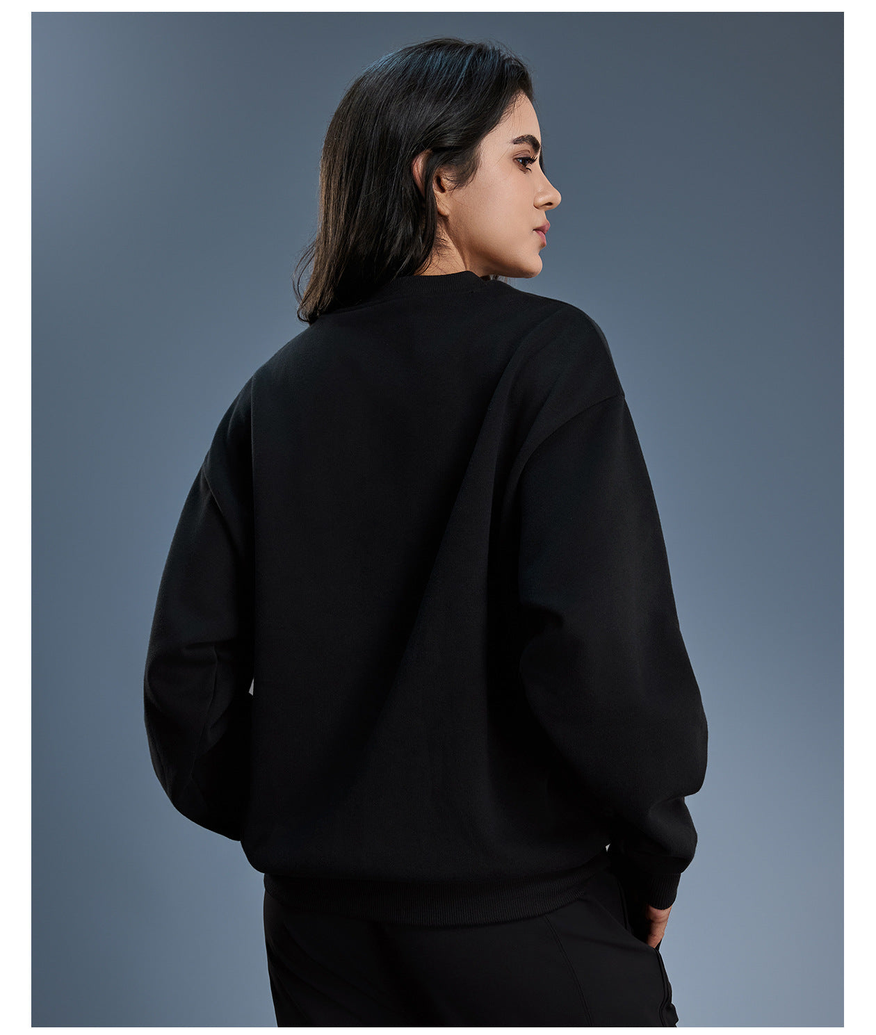 Black long sleeve fleece hoodie with ribbed cuffs and hem
