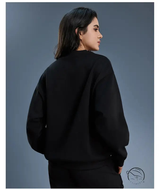 Black long sleeve oversized fleece hoodie with ribbed cuffs