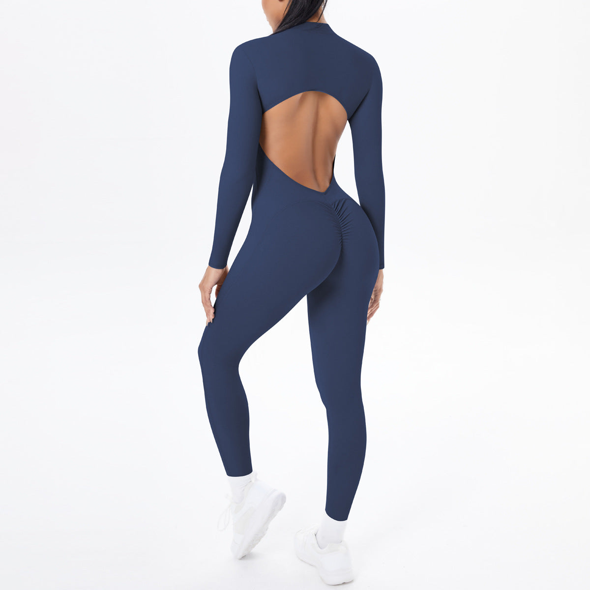 Navy blue long sleeve yoga one-piece with back cutout and ruched waistband