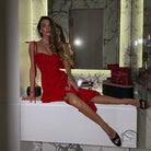 Woman in elegant ruffled socialite sling dress