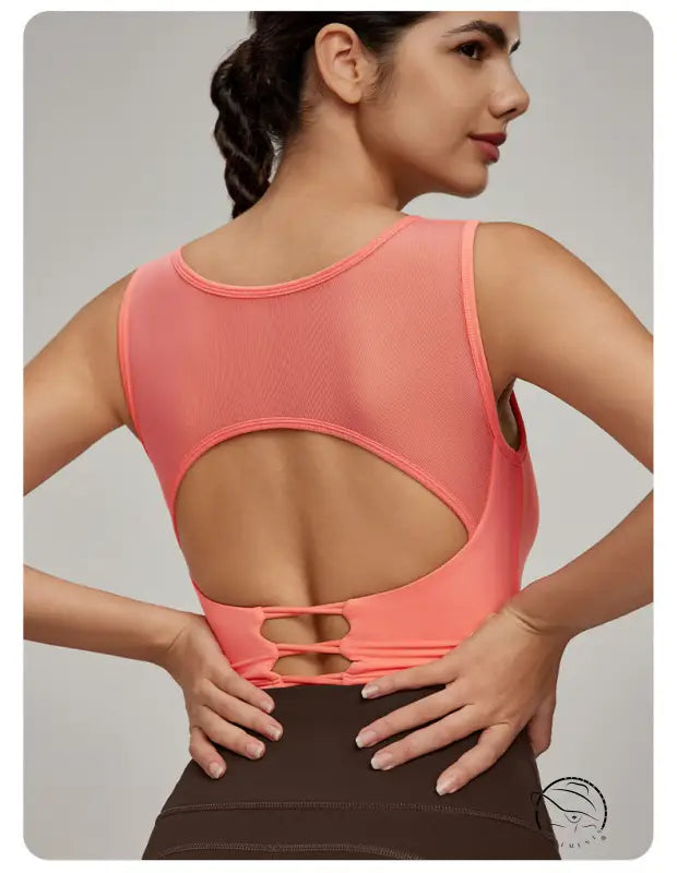 Beauty Back Mesh Workout Top in coral with mesh back and cut-out detail