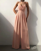 Blush pink strapless modern jumpsuit with pleated wide-leg pants