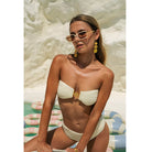 White ribbed bikini with bandeau top and matching bottom, perfect for stylish summer fashion