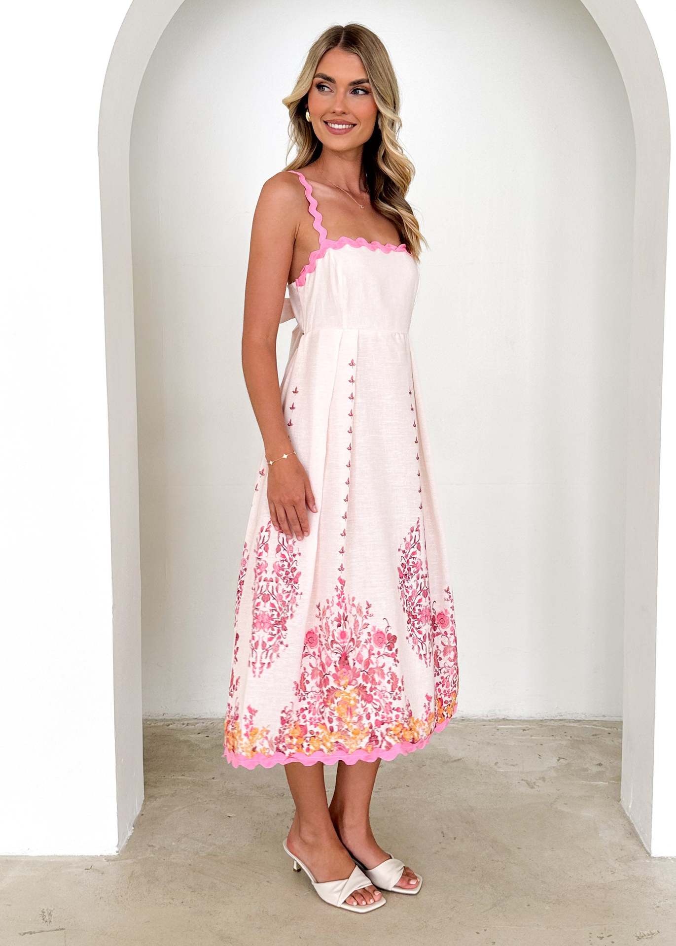White sundress with pink floral print, stylish backless design for trendy fashion ملابس