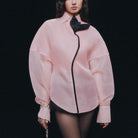 Pink langry fashion blouse with black accents and bow detail