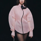 Pink langry fashion blouse with black accents and bow, loose top