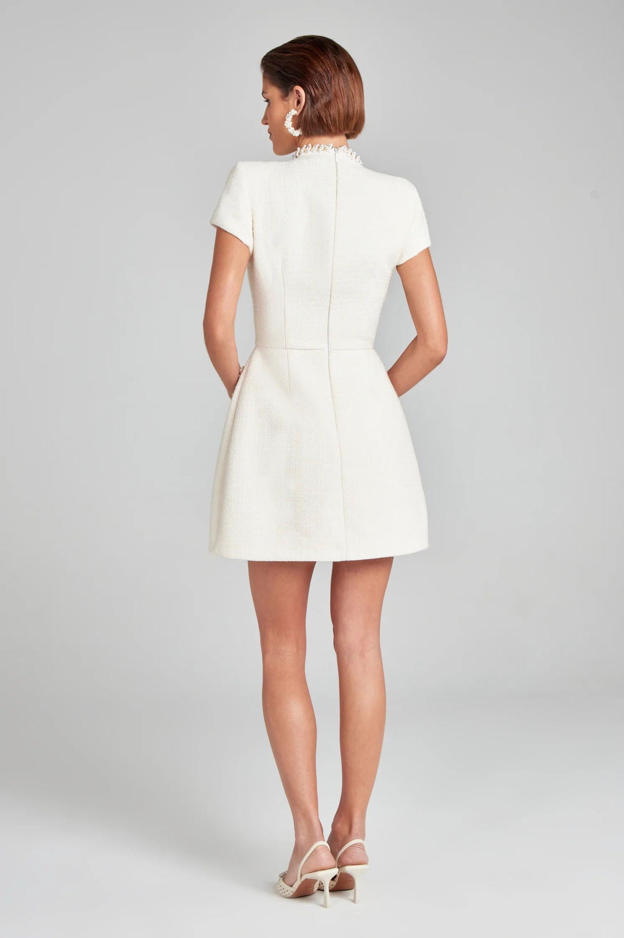 Elegant Slim Classic Dress: Short white dress with cap sleeves, showcasing modern fashion design
