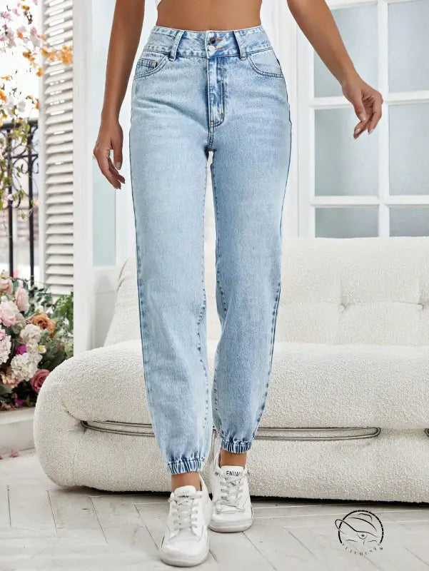 Light wash blue high-waisted drooping loose denim pants with elastic cuffs