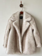 Warm collar mid-length faux fur jacket in cream with black label