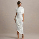 Elegant slim pleated dress in white with high neckline and asymmetrical hem