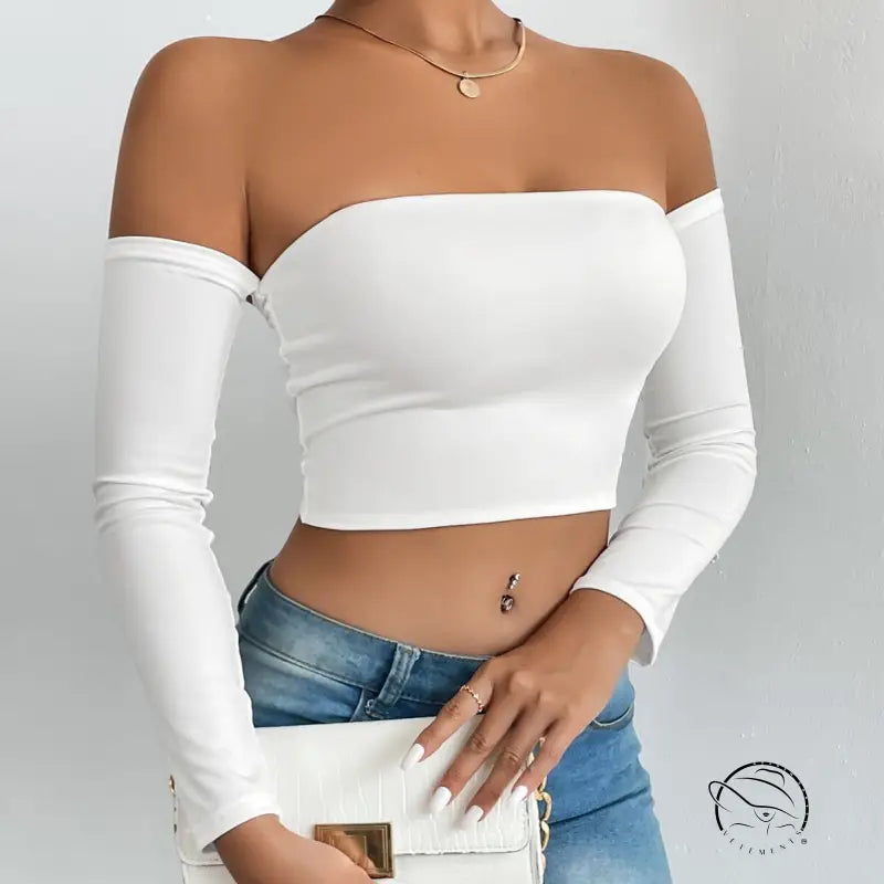 Woman in camisole waist trimming short sleeve cropped tube top, jeans, handbag