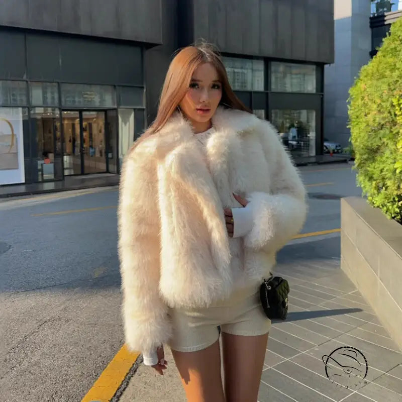 Cream faux fur oversized coat with fluffy texture and wide collar by Langry