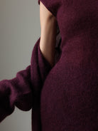 Maroon textured knitted cardigan with rolled sleeves and pocket detail