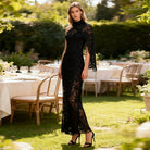 Elegant black lace langry evening gown with bell sleeves and high neckline