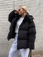 Black puffer jacket from Cotton Coat Jacket, ideal for fashion-forward ملابس enthusiasts