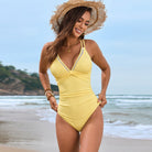 Yellow v-neck one-piece swimsuit with white trim detailing for stylish summer fashion ملابس