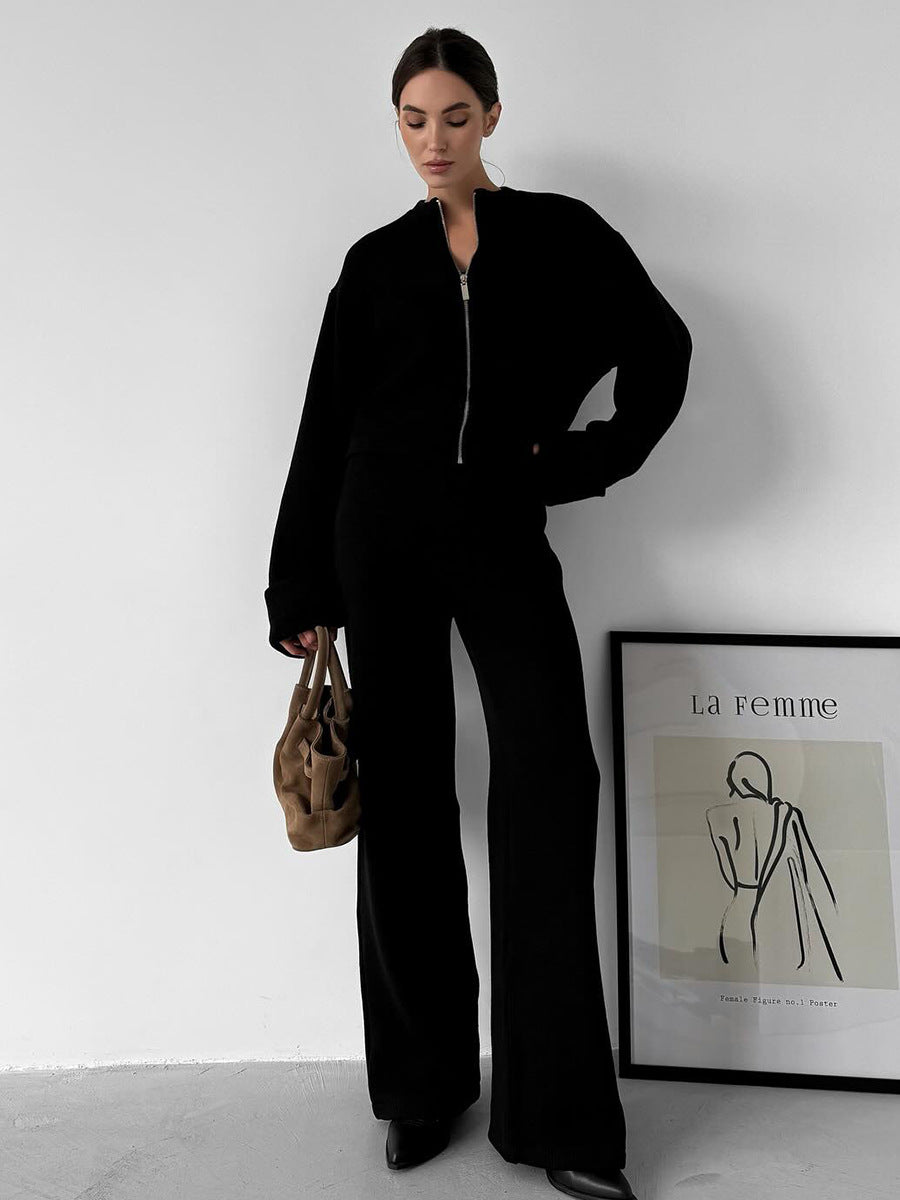 Black zip-up langry jumpsuit with wide-leg pants and pockets, enchanting fashion ملابس