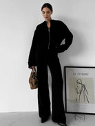 Black zip-up langry fashion jumpsuit with wide-leg pants and pockets