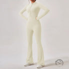 Cream-colored zip-front Comfy One Piece Sportswear jumpsuit with flared legs and long sleeves