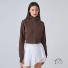 Brown cropped hooded cardigan sweater with white skirt
