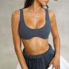 Sleek dark gray langry fashion sports bra with thin straps and rounded neckline