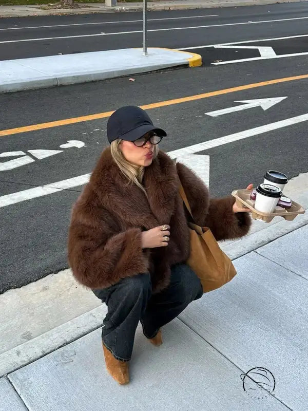 Gorgeous faux fur Langry fashion jacket with oversized sleeves and black cap