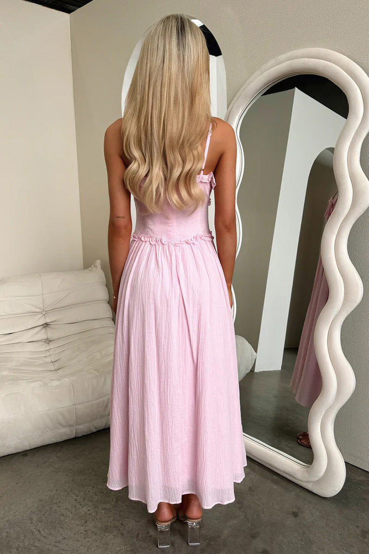 Pink sleeveless maxi dress with bow hair accessory, a stylish choice in ملابس fashion