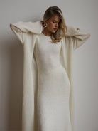 Cream-colored ribbed knitted cardigan sleeveless dress with puffed sleeves