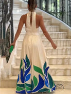 Summer printed womens white halter neck flared shorts jumpsuit with leaf print