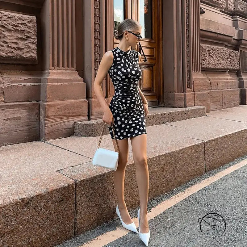 Polka dot mesh sheath dress with white heels and crossbody bag