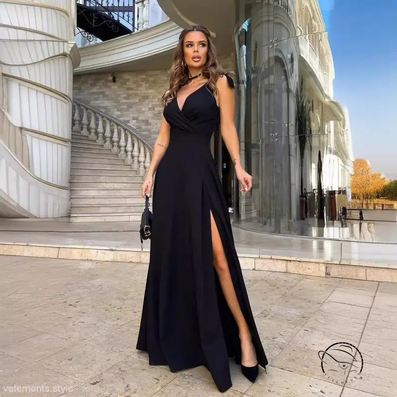 Elegant black slit dress in lengthened evening style