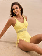 Bright yellow one-piece swimsuit with mesh cutouts and ruched ties for stylish fashion