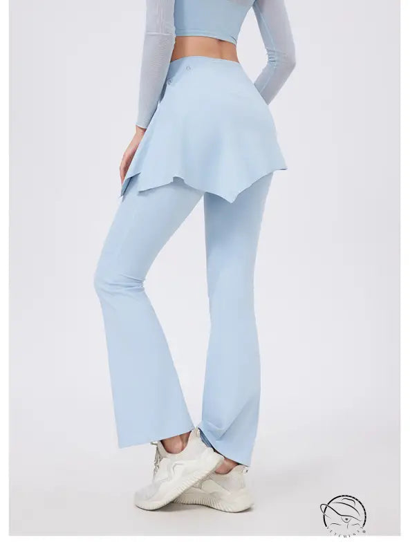 Light blue hip lifting yoga pants with nude feel ruffled hem and white sneakers