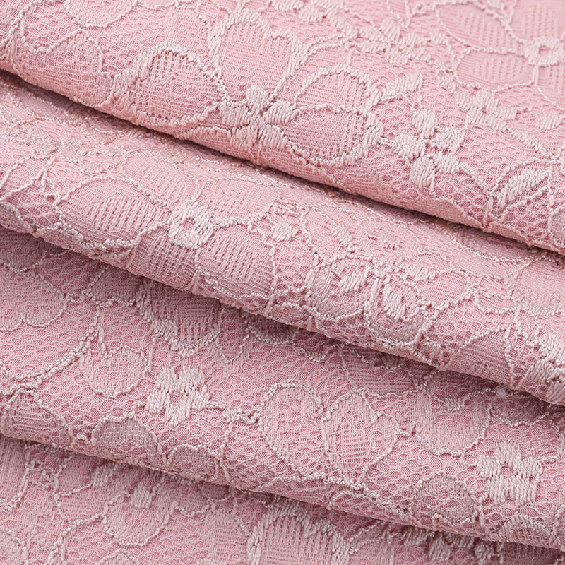 Elegant dusty rose lace jumpsuit with floral pattern and delicate texture in Langry fashion