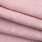 Elegant dusty rose lace jumpsuit with floral pattern and delicate texture in Langry fashion