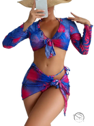 Four piece lace up swimsuit in vibrant blue and pink tropical leaves